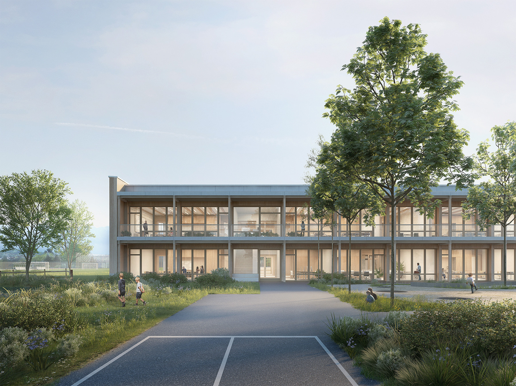 Aussenansicht des neuen Schulhauses St. Martin in Sursee mit vorgelagertem Platz und grosszügiger Verglasung im Erdgeschoss