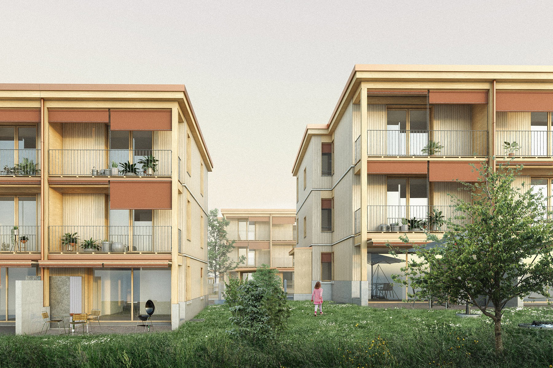 Blick auf die Südfassaden mit vorgelagerten Balkonschichten und privaten Gärten in der Wohnsiedlung Schwyzermatt in Willisau.